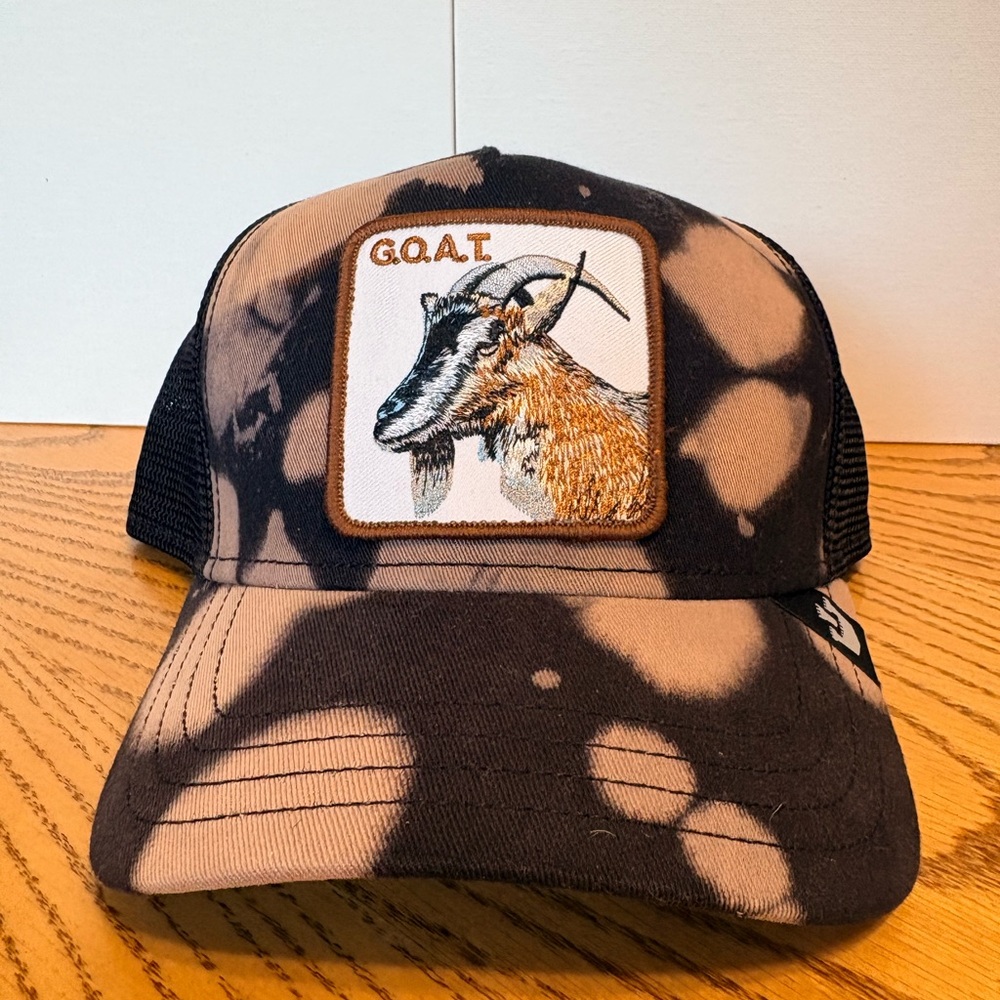 Goorin Bros Bleach-Effect G.O.A.T. Patch Trucker Hat in Black and Tan
